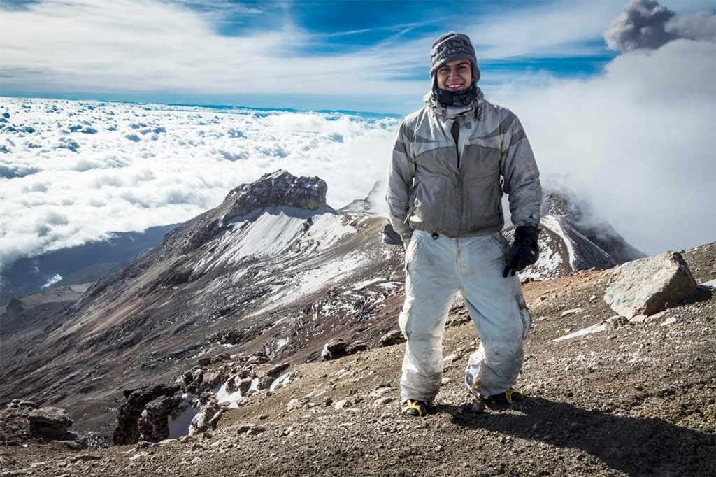 Rocky high-altitude terrain and snow-streaked ridges