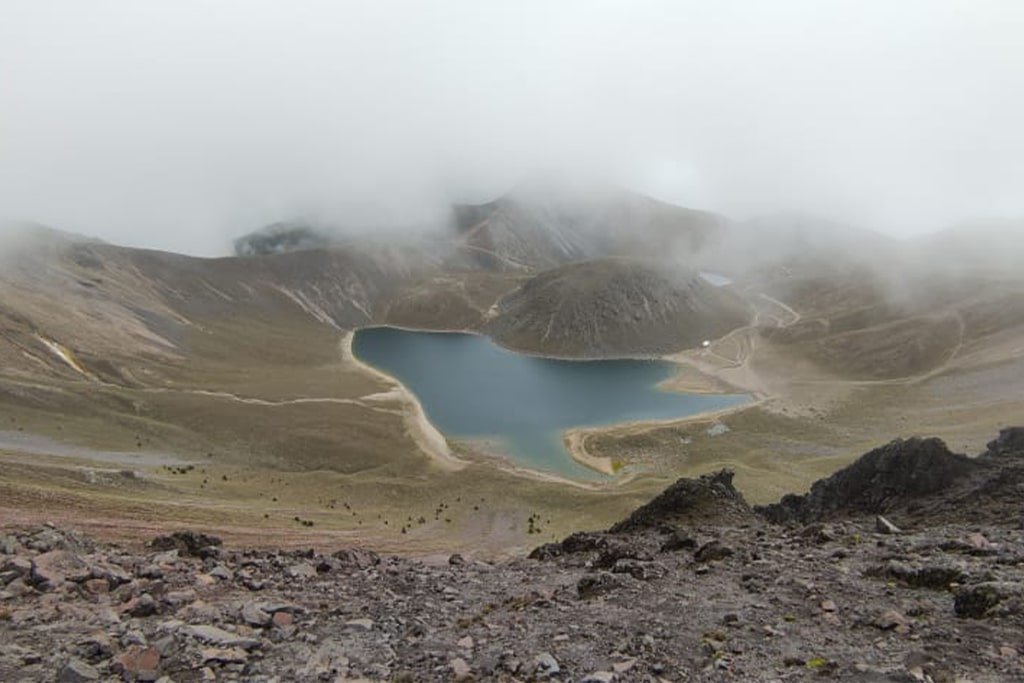 The Sun lagoon seen from the rocky crater wall
